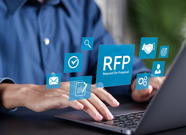 person typing on laptop with a box stating RFP